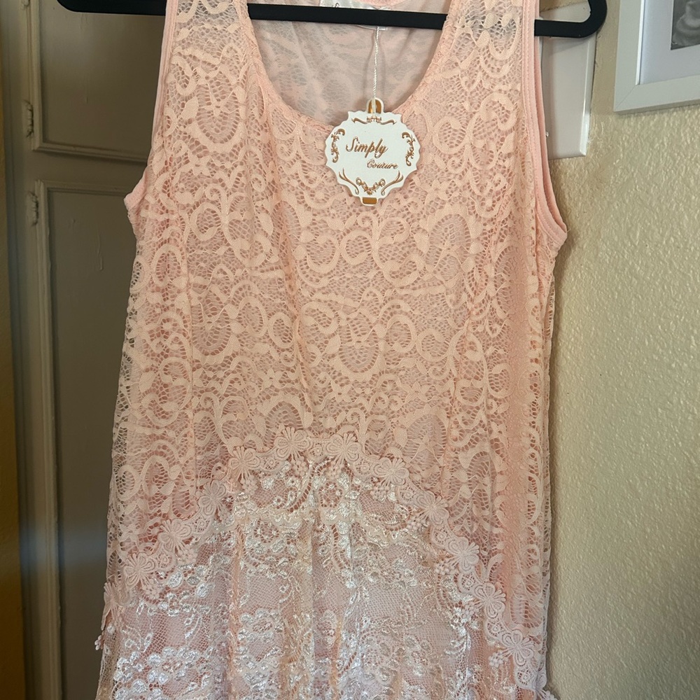 Pretty dress or tunic. Nice peach color